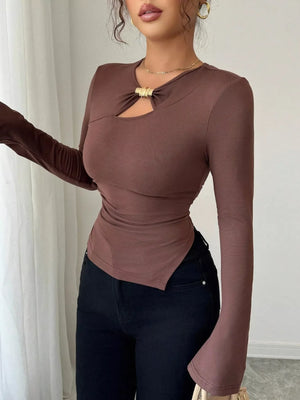 Brown long-sleeve top with asymmetrical cutout and gold hardware detail
