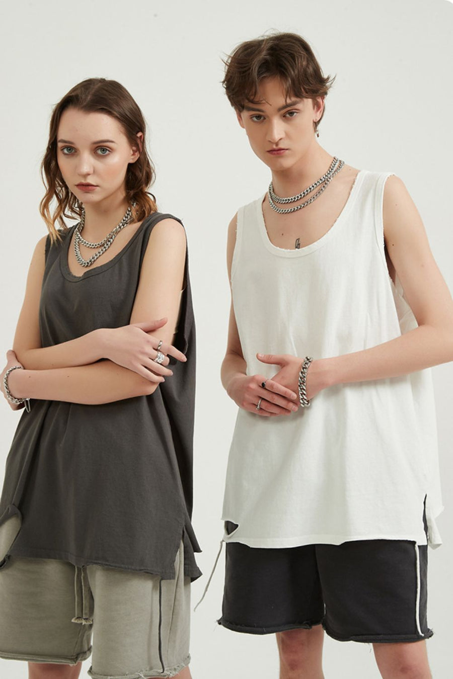 Dark grey and white sleeveless tops with raw edges