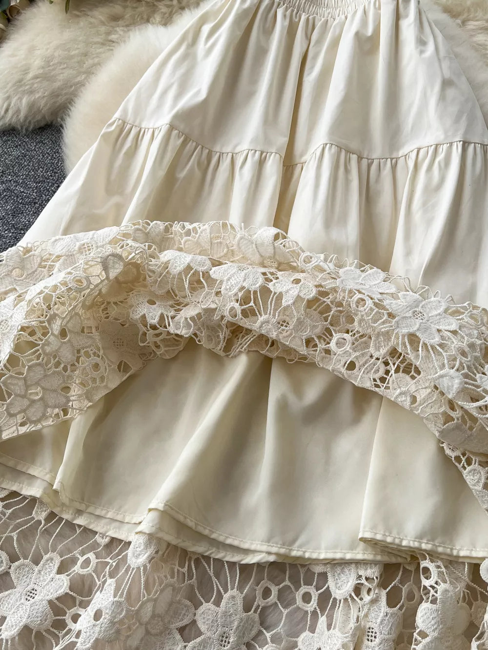 Apricot tiered skirt with elastic waist and intricate lace trim detail