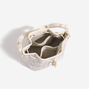 crossbody bag in cream with geometric and drawstring closure