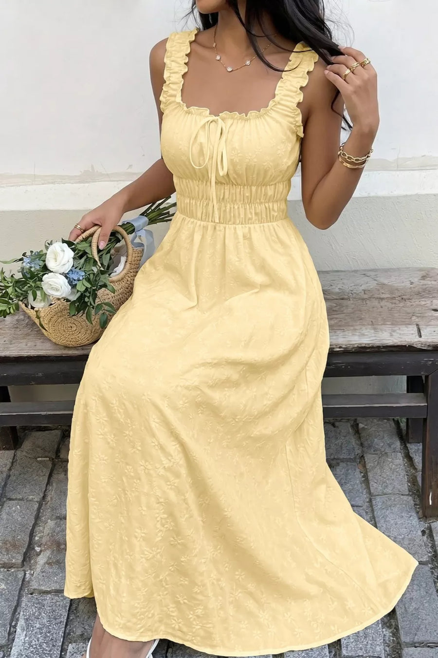 Yellow smocked floral maxi dress with frill straps and tie front.