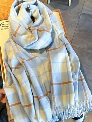 Sky blue plaid fringe scarf with tan and white accents.