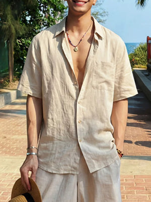 Relaxed fit beige linen button-down shirt with short sleeves and a chest pocket.