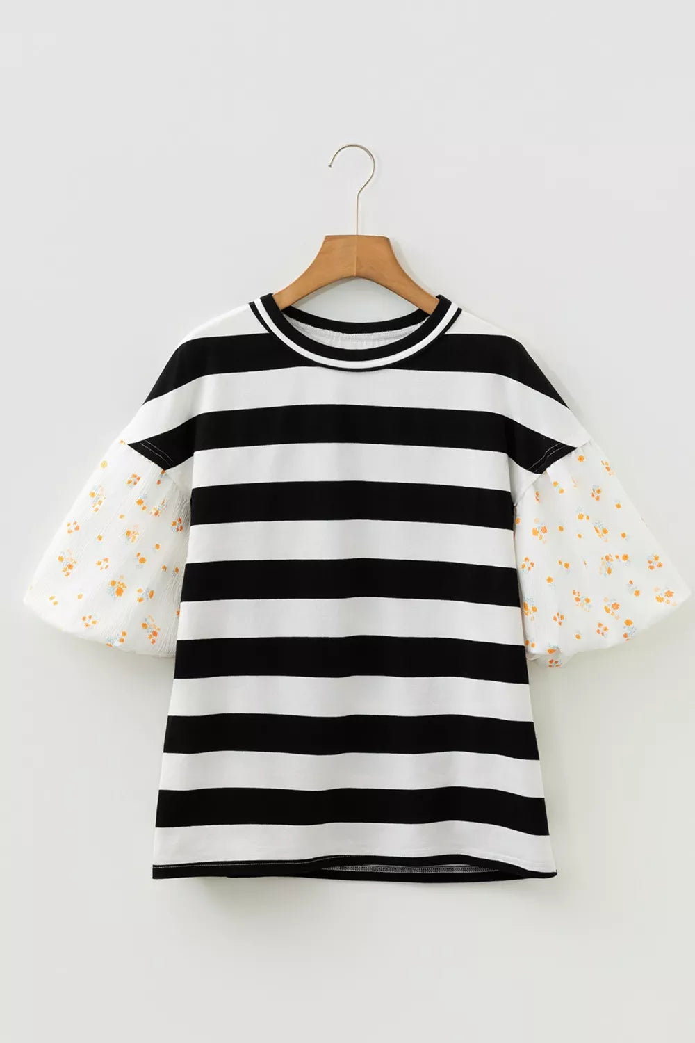 Maternity t-shirt with black and white stripes and floral puff sleeves.