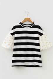 Maternity t-shirt with black and white stripes and floral puff sleeves.