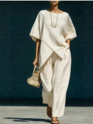 two-piece set in ivory featuring asymmetric hem and loose fit