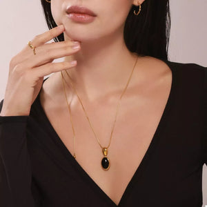 18K Gold-Plated, Stainless Steel, Black agate Care instructions: Avoid wearing d necklace in black with jewelry silhouette
