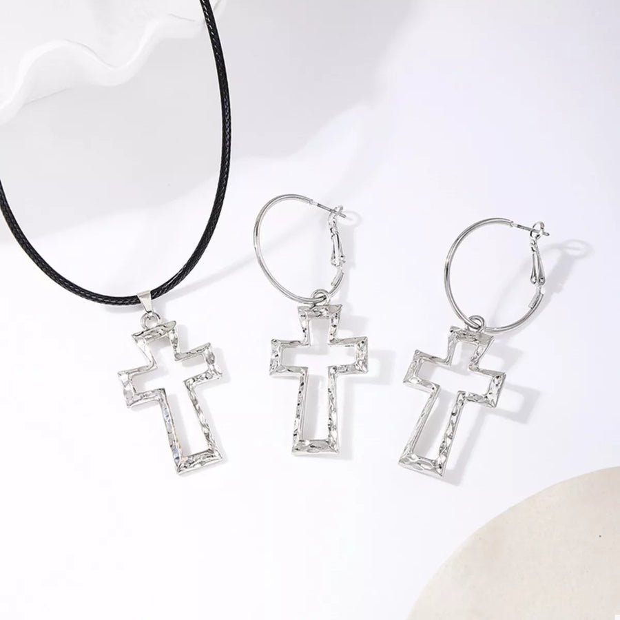 Silver cross pendant necklace and hoop earrings set with textured detail