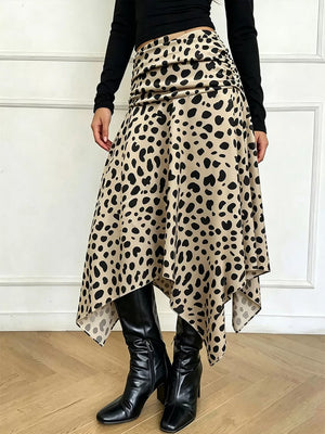 Leopard print midi skirt with asymmetrical hem and ruched detail.