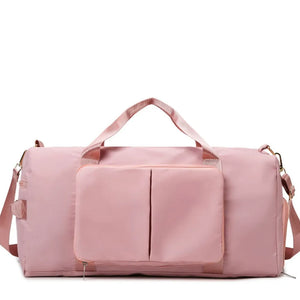 Pale Blush duffel bag with front pockets and adjustable strap