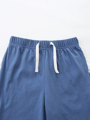 Baby blue cotton shorts with elastic waist and white drawstring detail.