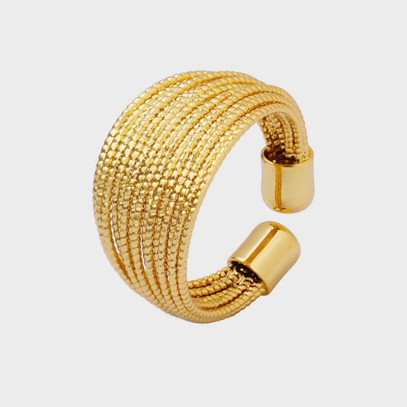 Gold textured coil open-ended ring with multiple strands.