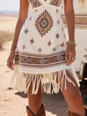 White mini dress with Southwestern geometric print and fringe hem.