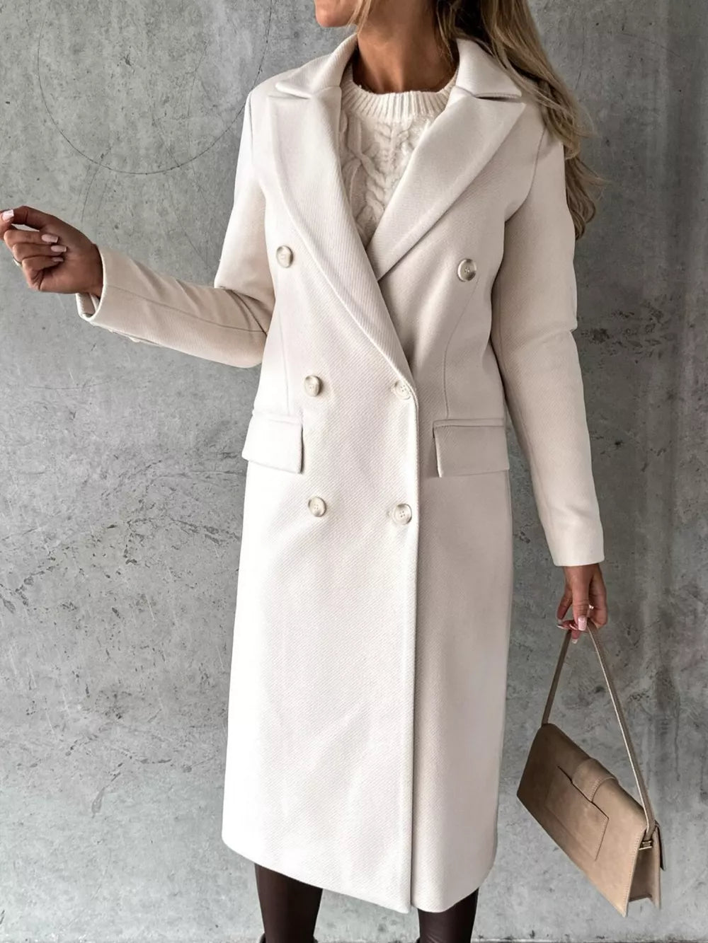 Chic double-breasted longline trench coat in apricot with button details.