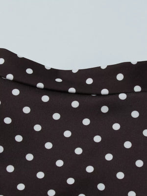 Brown polka dot mini dress with a cut-out detail and a curved neckline.