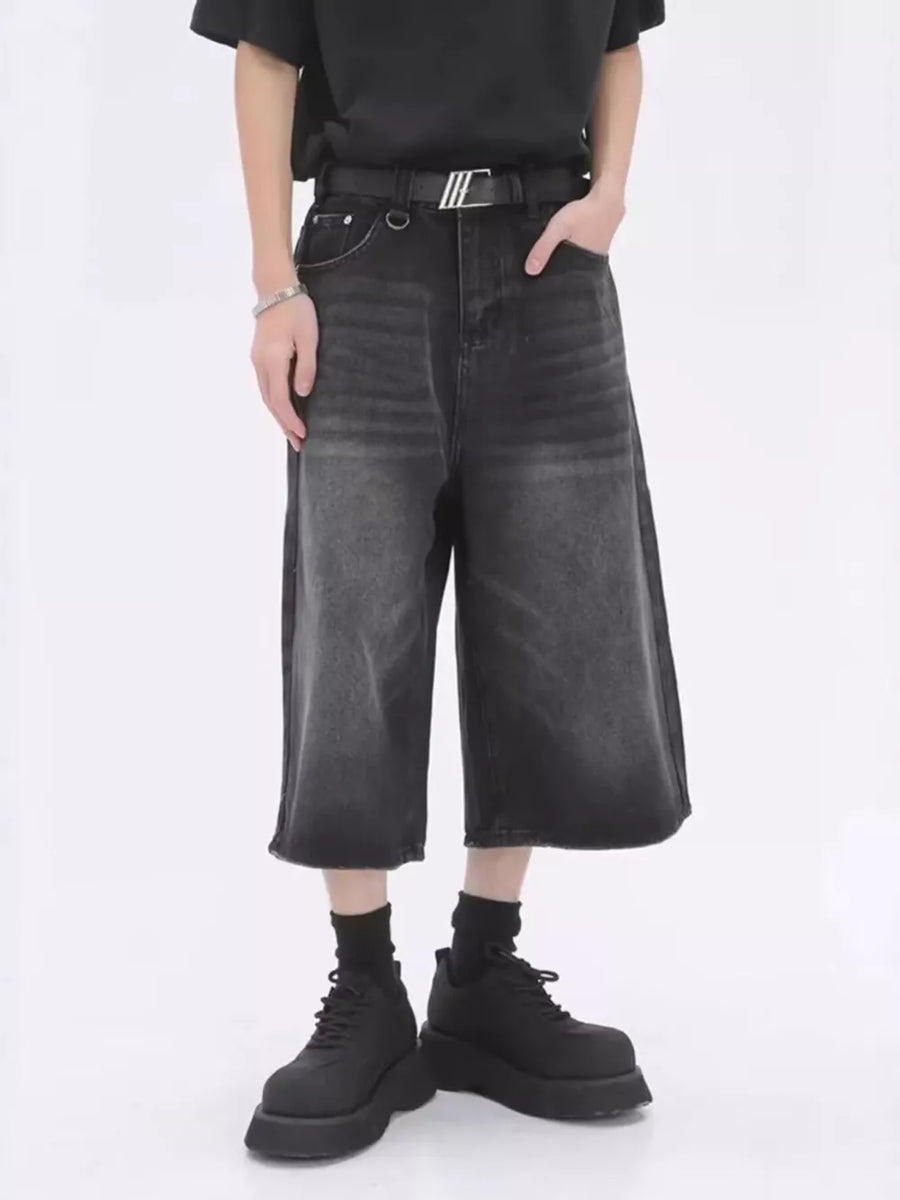 Dark wash wide-leg denim culotte shorts with a vintage fade.