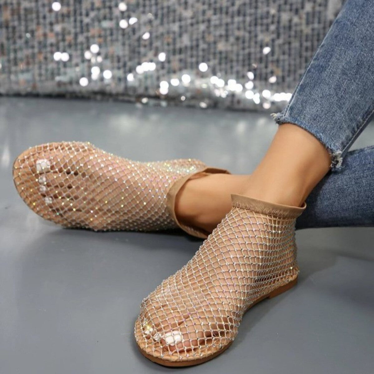 Glistening rhinestone mesh ankle boots in creamy-white with round toe.