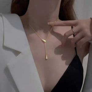 Gold Y necklace with triangle pendant and diamond accent, sterling silver