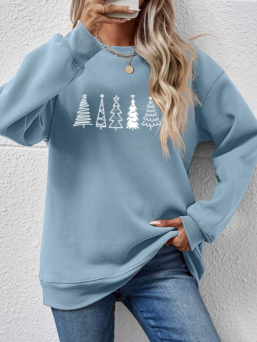Misty Blue oversized sweatshirt with a festive tree line graphic and crew neck.