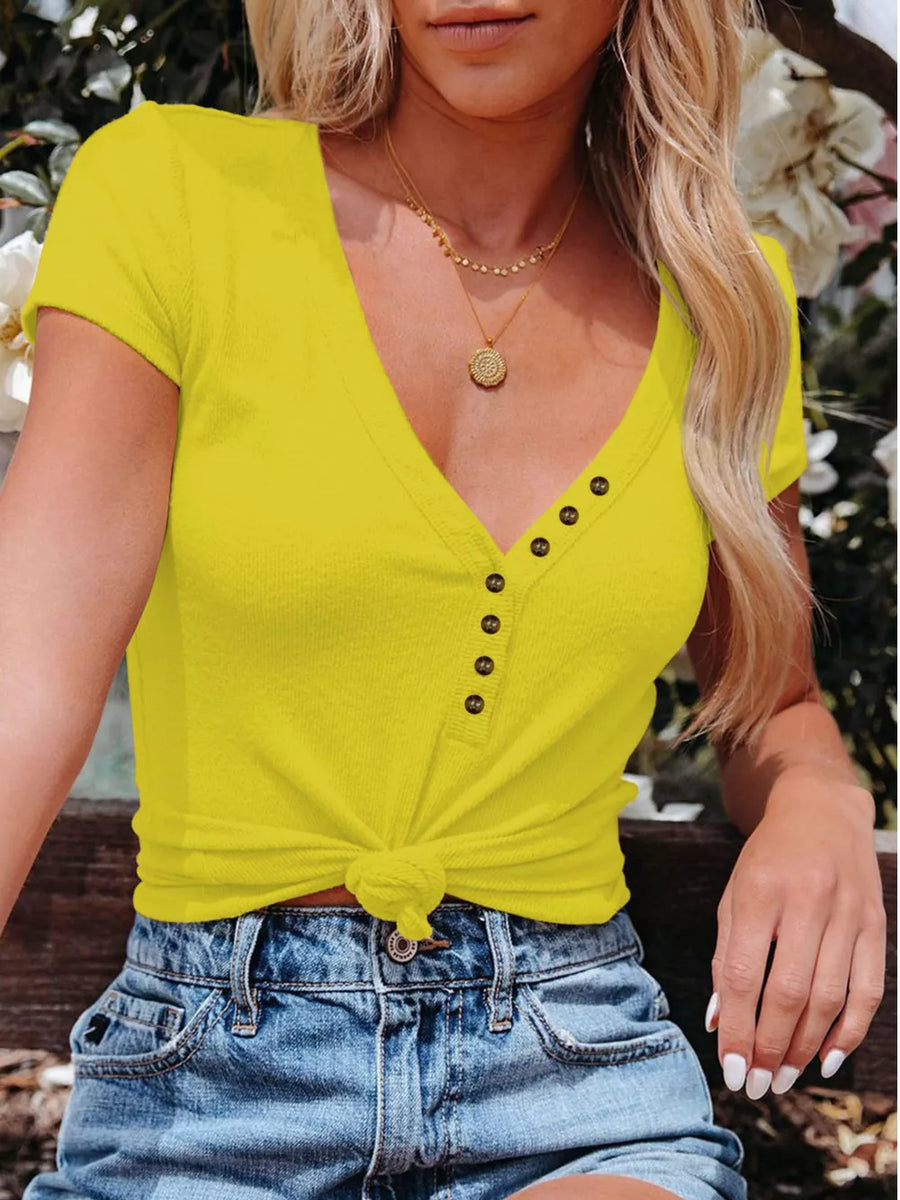 Yellow V-neck buttoned t-shirt with short sleeves and a knotted hem.