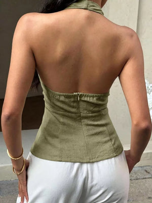 Textured halter tank top in olive green with decorative bands and a zipper back closure.