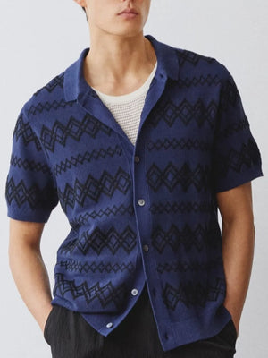 Navy geometric knit camp collar shirt with short sleeves and button front.