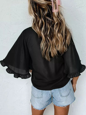 Black ruffled mock neck half sleeve shirt with sheer flutter sleeves.