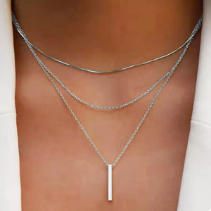 Silver layered bar pendant necklace with delicate chains.
