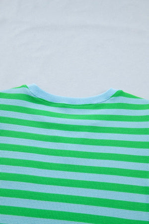 Striped crewneck sweater in green and light blue waffle knit fabric.