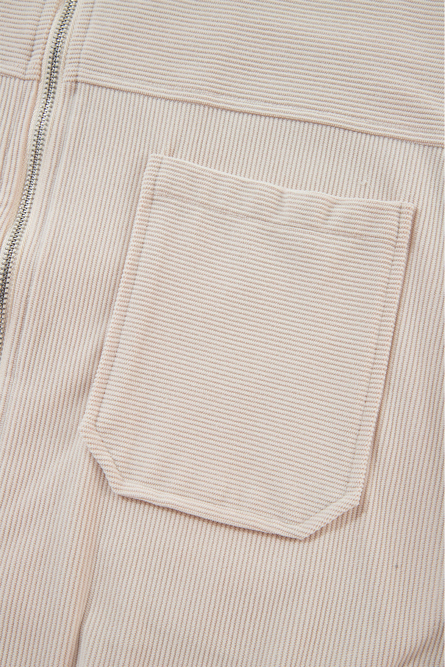 Cream corduroy bomber hoodie with a chest pocket and zipper detail.
