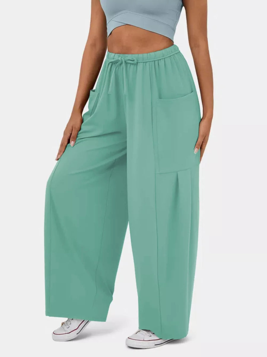 Light Green maternity wide-leg pants with drawstring waist and pockets.