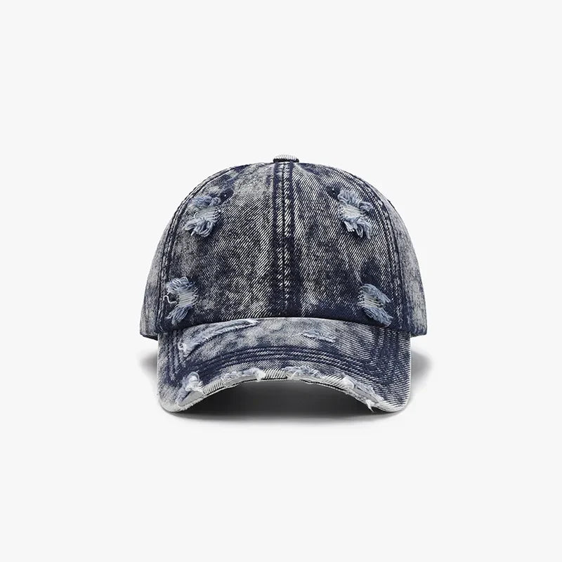 Acid wash denim baseball cap with distressed details and frayed brim