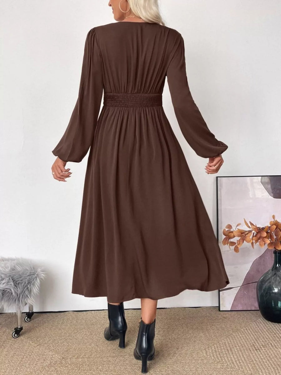 Brown V-neck midi dress with puff sleeves and smocked waist.