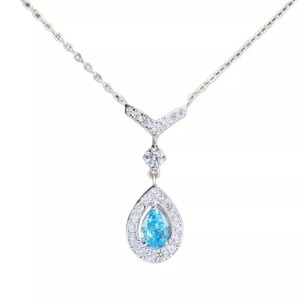 light blue necklace featuring teardrop pendant and geometric