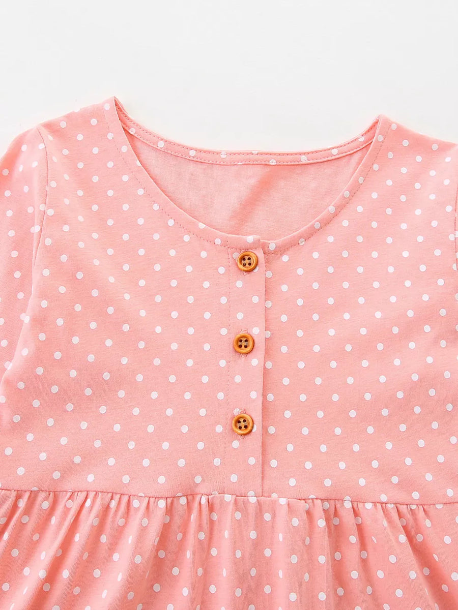 Pink polka dot cotton dress with round neck and button front.