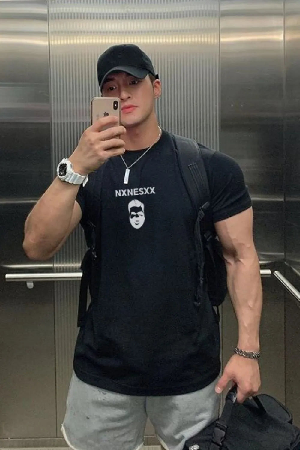 Black graphic crew neck muscle tee with white graphic print and text.