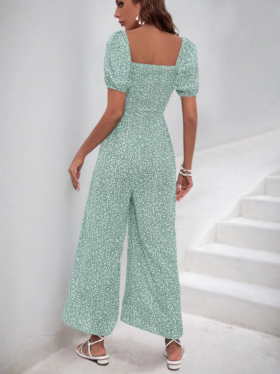 Light green floral print jumpsuit with smocked bodice and wide legs