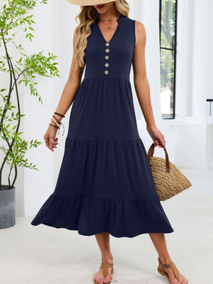 Navy tiered midi dress with notched V-neck and decorative buttons.