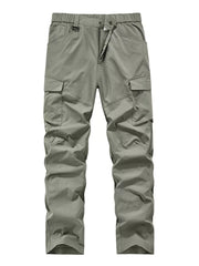 Sage cargo pants with elastic waist and drawstring, featuring multiple pockets.