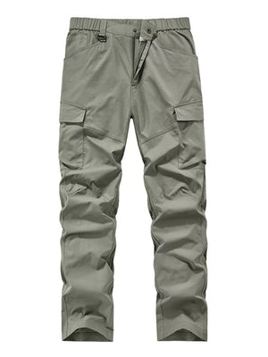 Sage cargo pants with elastic waist and drawstring, featuring multiple pockets.