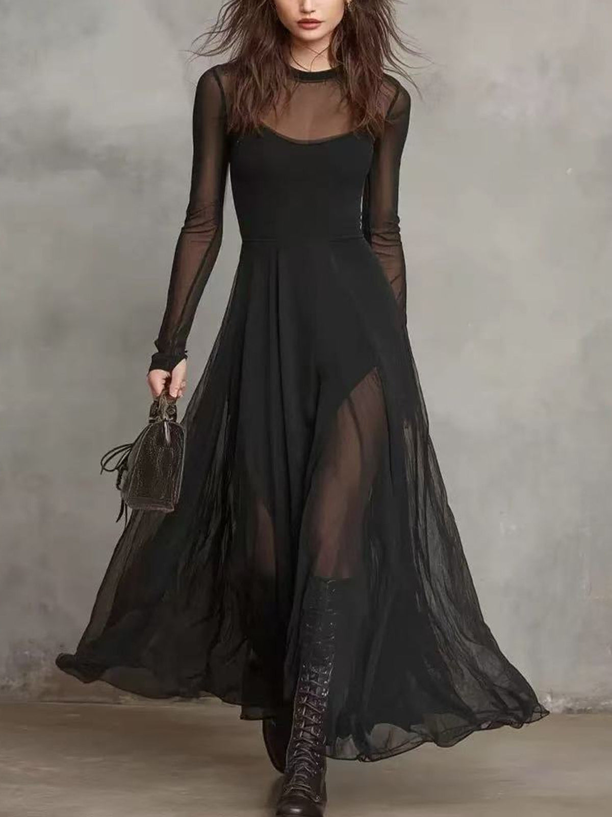 Black sheer mesh maxi dress with long sleeves and a high neckline.