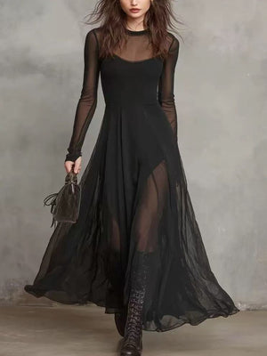 Black sheer mesh maxi dress with long sleeves and a high neckline.