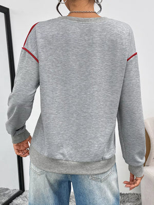 Gray sweatshirt with red trim on shoulders and cuffs, crew neck, long sleeves.