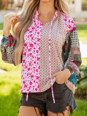 Boho floral patchwork blouse with tie neck and bubble sleeves in fuchsia pink.