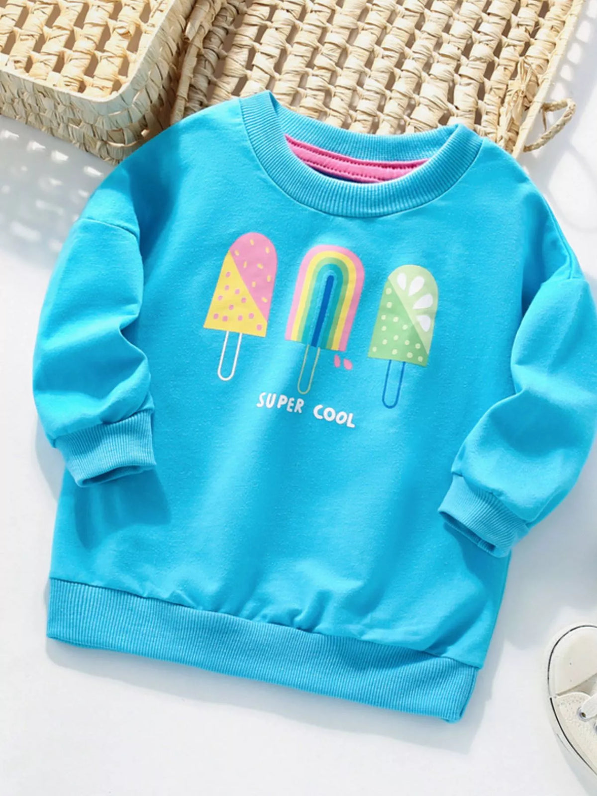 Baby blue cotton sweatshirt with ice cream graphics and "SUPER COOL" text.