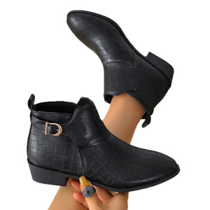 Black boots featuring point toe and animal-print