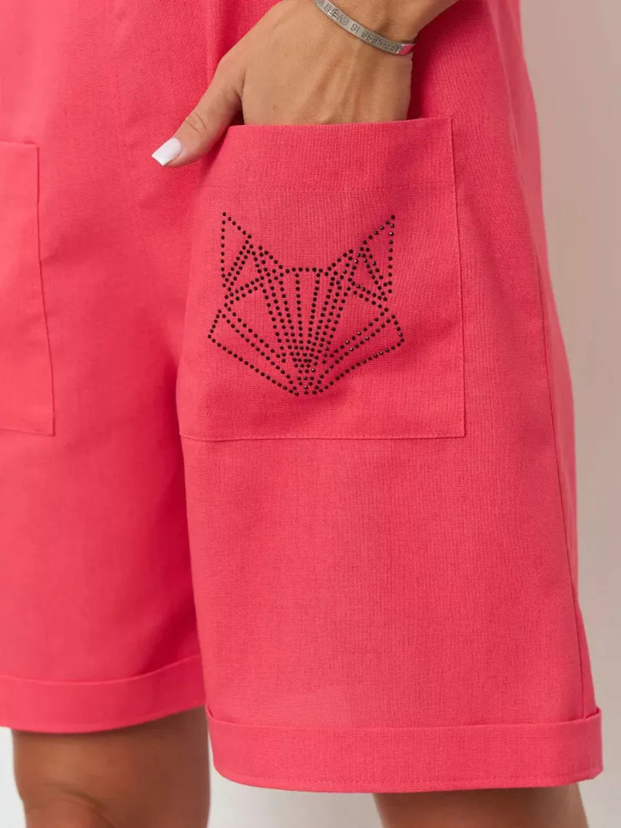 Cotton romper in red with a rhinestone fox pocket detail and cuffed hem.
