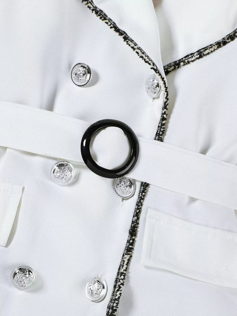 White double-breasted toddler dress with belted waist and decorative buttons.