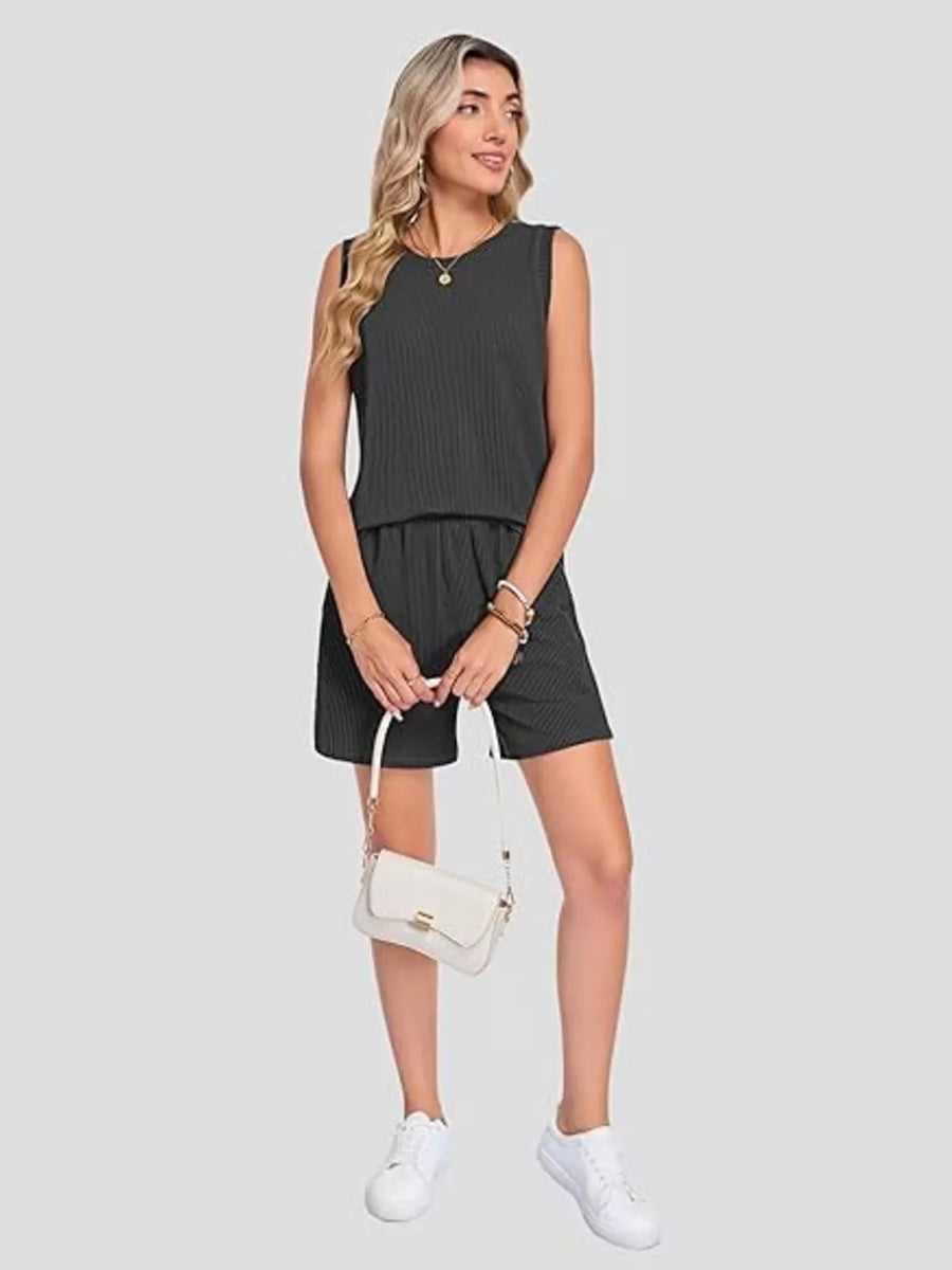Sleek black ribbed knit set with pockets, sleeveless top and shorts.
