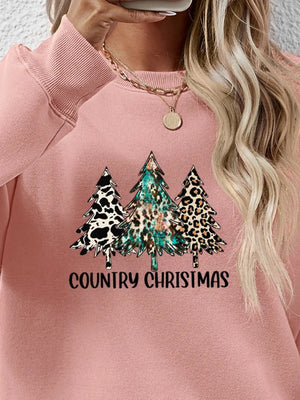 Blush pink crewneck sweatshirt with country Christmas trees graphic and text.